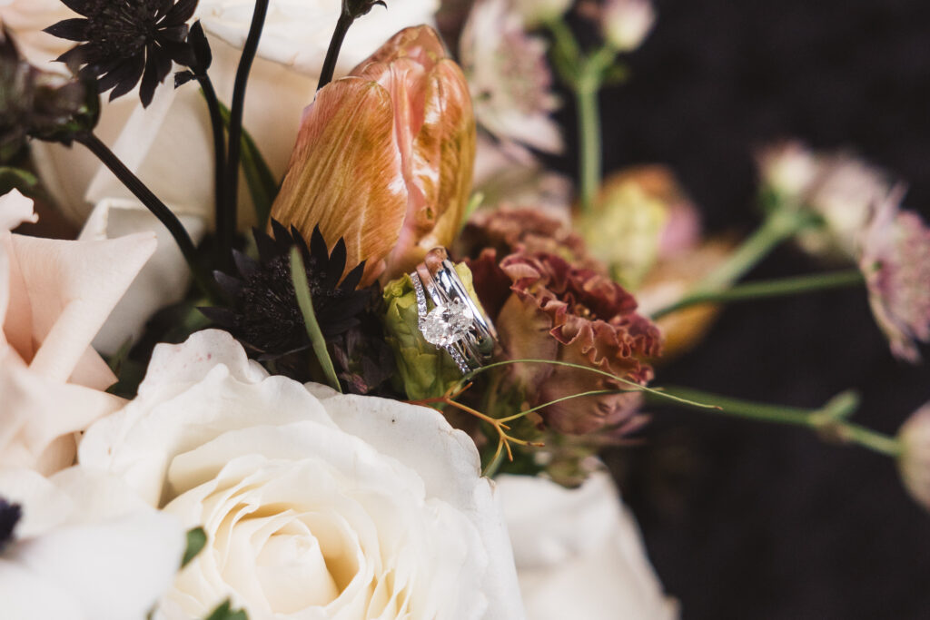 Wedding rings in a bouquet. Taken by Madison Neumann Photography.