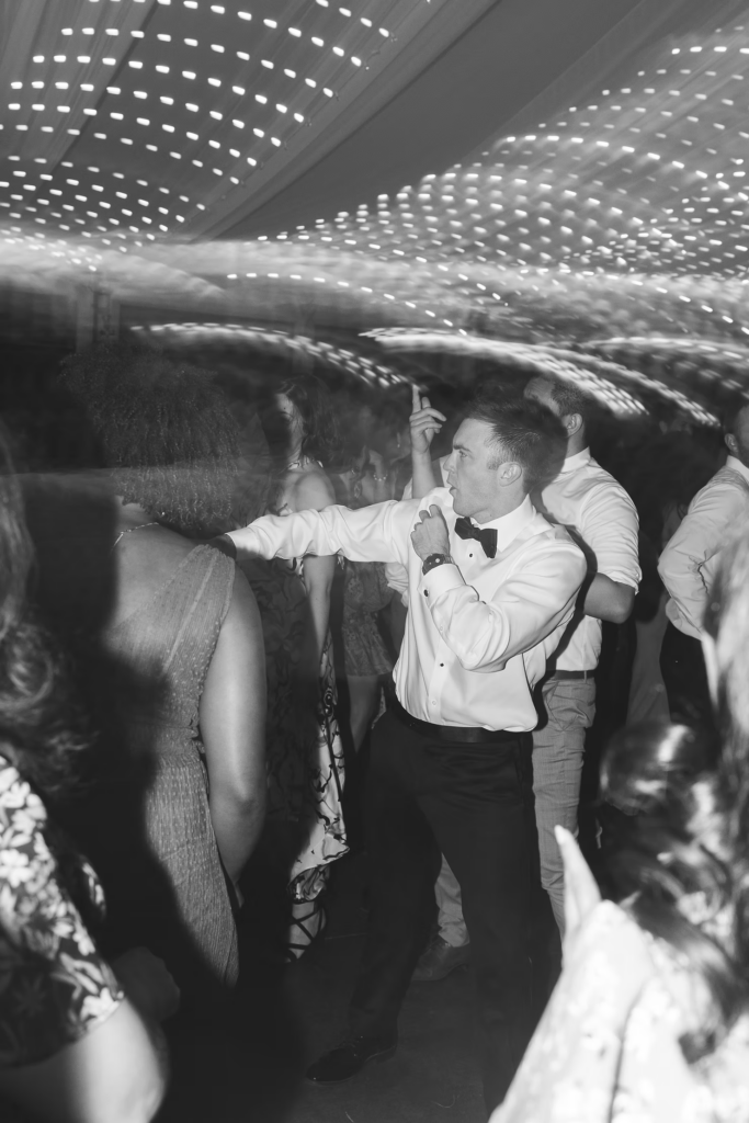 Fun black and white photo of groom on dance floor for wedding at Bartram's Garden in Philadelphia, PA. Photographed by South Jersey Philly wedding photographer Madison Neumann Photography.