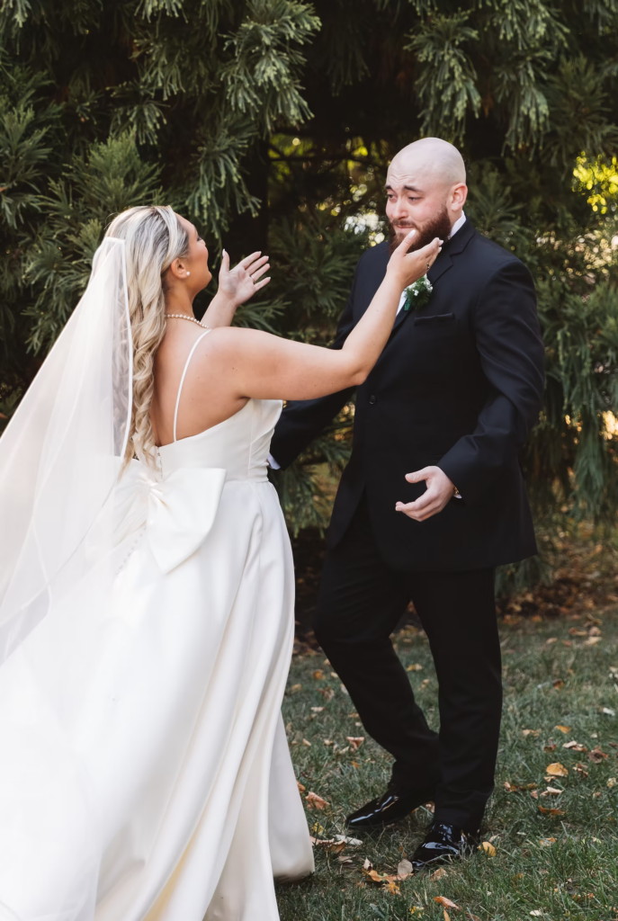 Groom gets emotional seeing bride in gown and veil for first look on their wedding day in Newtown Square, Pennsylvania. Photographed at The Ivy at Ellis Preserve by NJ, PA region wedding photographer Madison Neumann Photography.