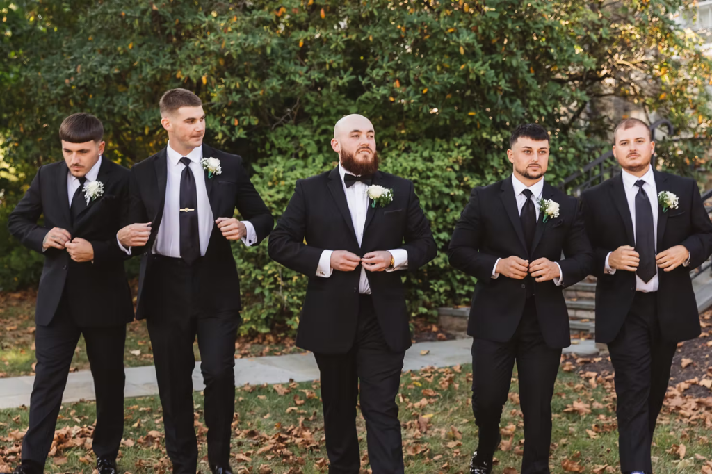 Groom with groomsmen in suits and boutonnières ready for wedding day at The Ivy at Ellis Preserve in Newtown Square, PA. Photographed by South Jersey, Pennsylvania region wedding photographer Madison Neumann Photography.