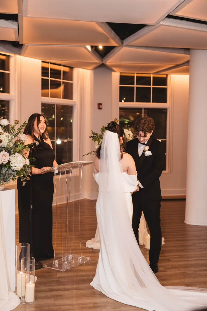 Bride and groom at the altar during wedding ceremony. Wedding day at Maritime Parc in Jersey City, NJ. Photographed by South Jersey, Philadelphia based wedding photographer Madison Neumann Photography.