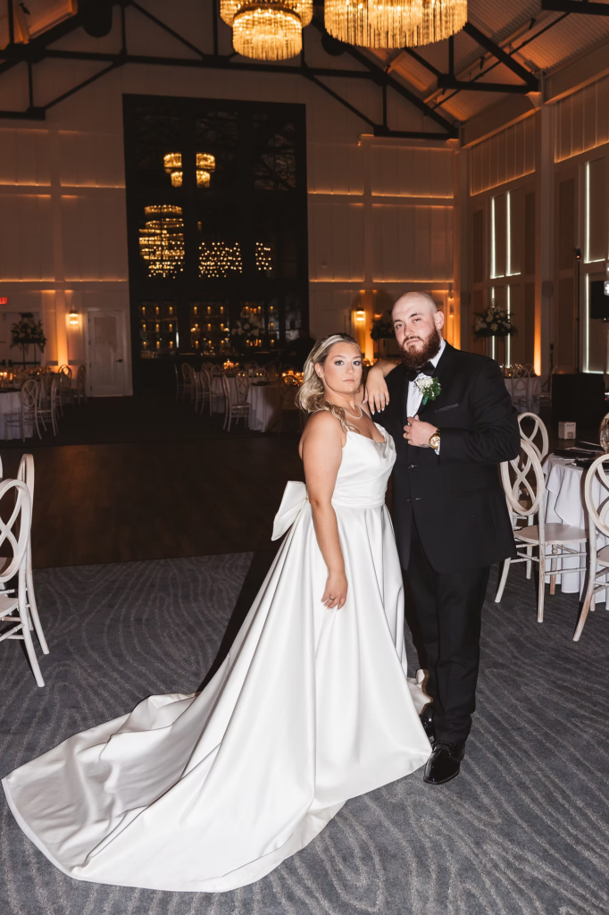 Flash photography portrait of newlywed bride and groom in reception ballroom space at The Ivy at Ellis Preserve by Finley Catering in Newtown Square, PA. Wedding day photographed by South Jersey, Pennsylvania region wedding photographer Madison Neumann Photography.