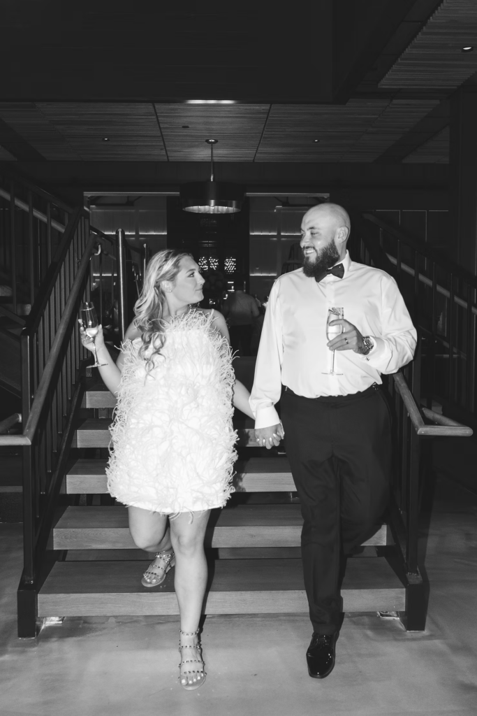 Bride in outfit change with groom re-enter reception to dance the night away. Wedding reception at The Ivy at Ellis Preserve by Finley Catering in Newtown Square, PA, photographed by South Jersey, Pennsylvania region wedding photographer Madison Neumann Photography.