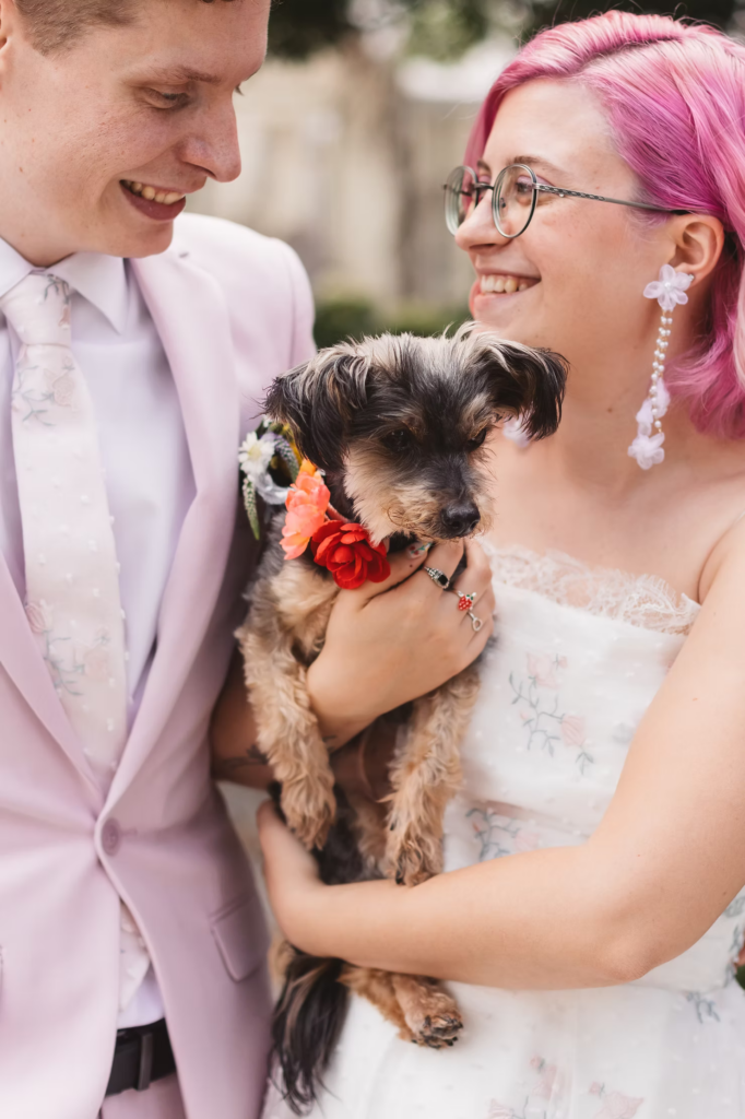 Bride and groom portrait with their dog at their colorful garden party wedding at terrain in glen mills, PA. Taken by philly wedding photographer Madison Neumann Photography.