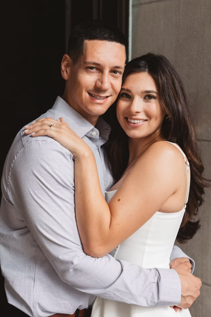 Fiancées smile together, future bride wears engagement ring for couples portraits in Philadelphia, PA. Engagement session photographed by Philly based photographer Madison Neumann Photography.