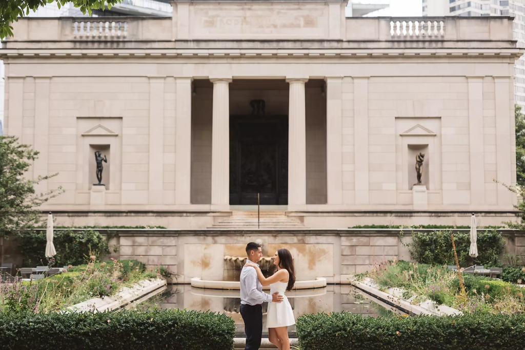 Future bride and groom together in front of fountain and greenery in the garden of The Rodin Museum in Philadelphia, PA. Photographed by Philly, South Jersey based wedding photographer Madison Neumann Photography.