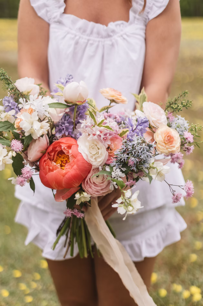 Bride getting ready for wedding with bouquet for Pennsylvania wedding in the Pocono Mountains. Photographed by South Jersey Philly Wedding Photographer Madison Neumann Photography.