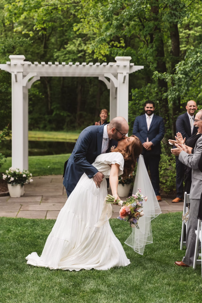 Mr and Mrs just married walking down the aisle for Pennsylvania wedding in the Pocono Mountains at The Lodge at Mountain Springs Lake. Photographed by South Jersey Philly Wedding Photographer Madison Neumann Photography.