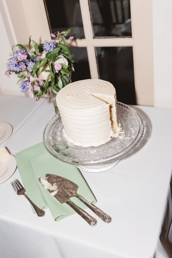Wedding cake after first slice with details for Pennsylvania wedding in the Pocono Mountains. Photographed by South Jersey Philly Wedding Photographer Madison Neumann Photography.