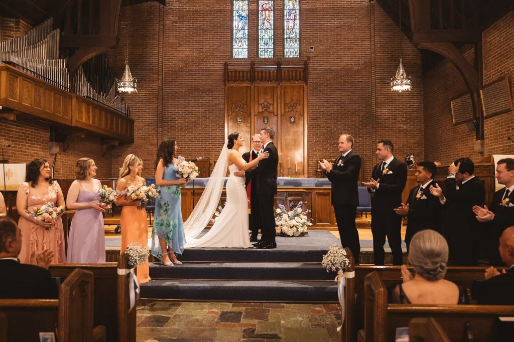 Bride and groom embrace at the alter of the church during wedding ceremony. Photographed at The Madison Hotel in Morristown, NJ by wedding photographer Madison Neumann Photography.