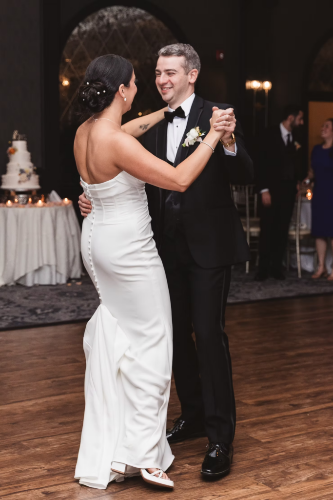 Bride and groom share first dance together in front of their wedding guests. Photographed at The Madison Hotel in Morristown, NJ by wedding photographer Madison Neumann Photography.