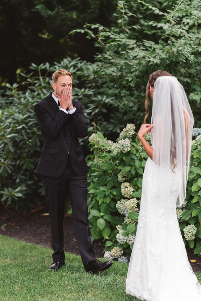 Groom excited to see his bride for first time during first look on wedding day at The William Penn Inn in Gwynedd, PA. Photographed by PA/NJ area wedding photographer Madison Neumann Photography.