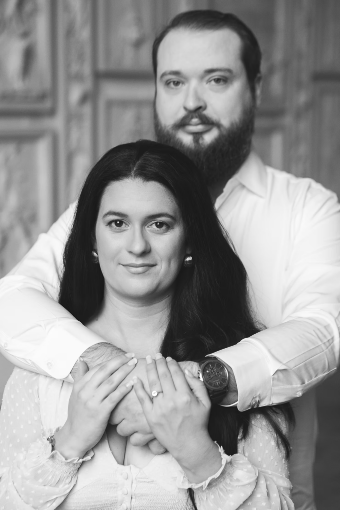A future bride and groom pose together in the halls of the Pennsylvania Academy of The Fine Arts for their art museum engagement session in Philadelphia. Photographed by Philly wedding photographer Madison Neumann Photography.