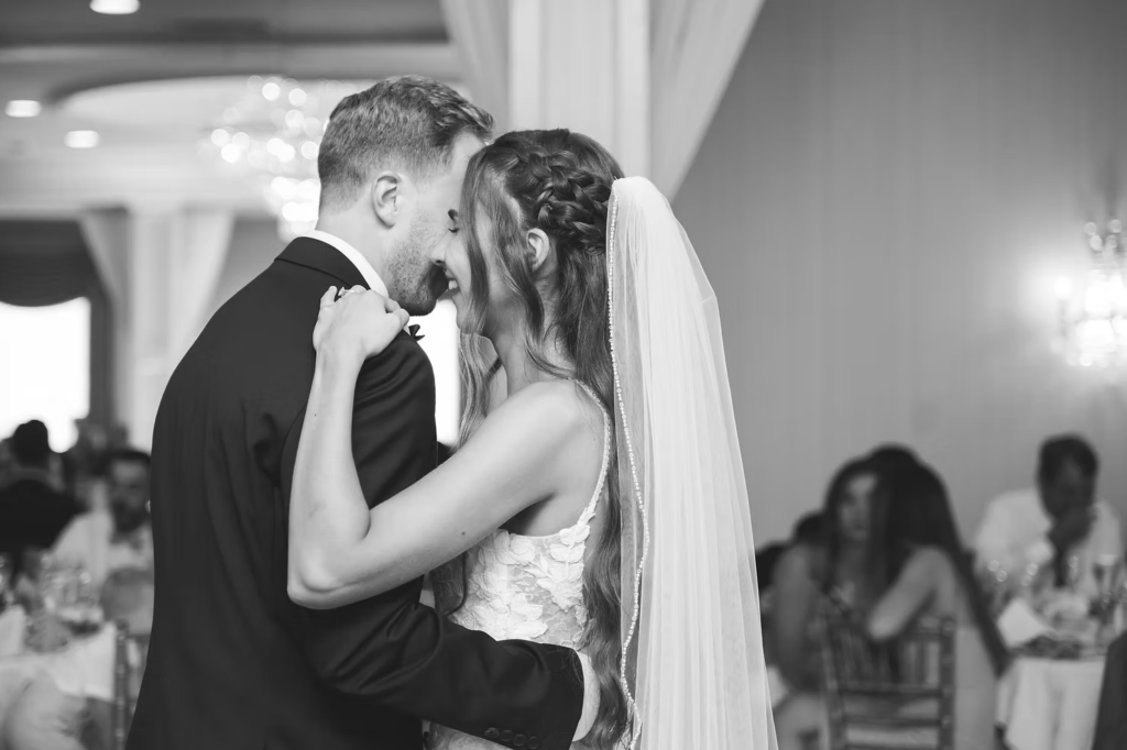 Black and white photo of newlyweds sharing their first dance for wedding day at The William Penn Inn in Gwynedd, PA. Photographed by Pennsylvania New Jersey area wedding photographer Madison Neumann Photography.