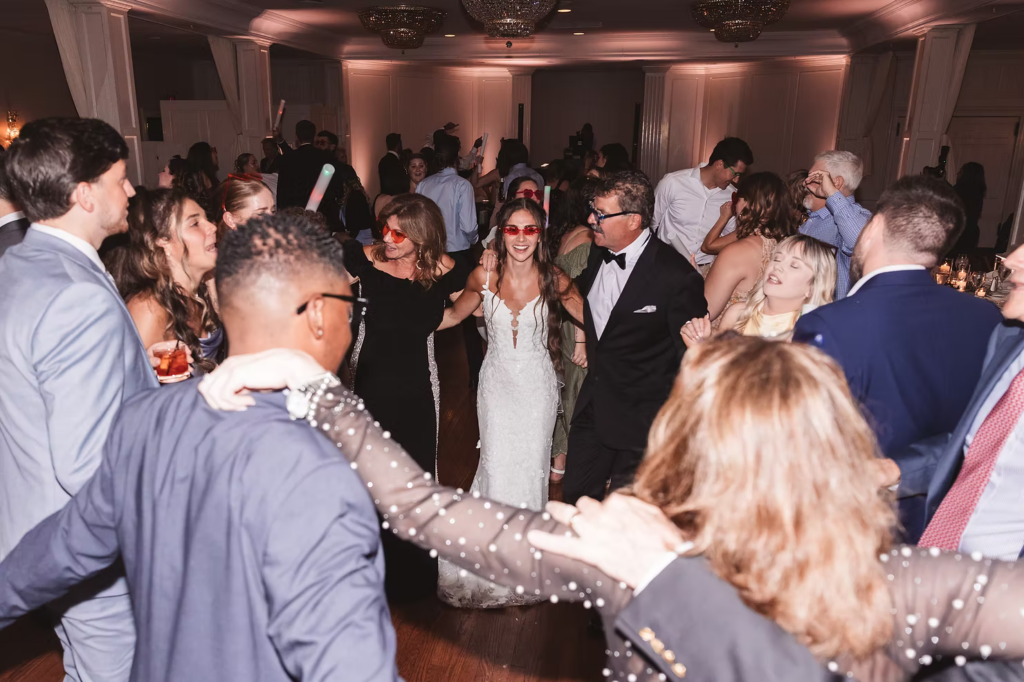 Bride celebrating wedding with family on dancelfoor for wedding day at The William Penn Inn in Gwynedd, PA. Photographed by Pennsylvania South Jersey area wedding photographer Madison Neumann Photography.