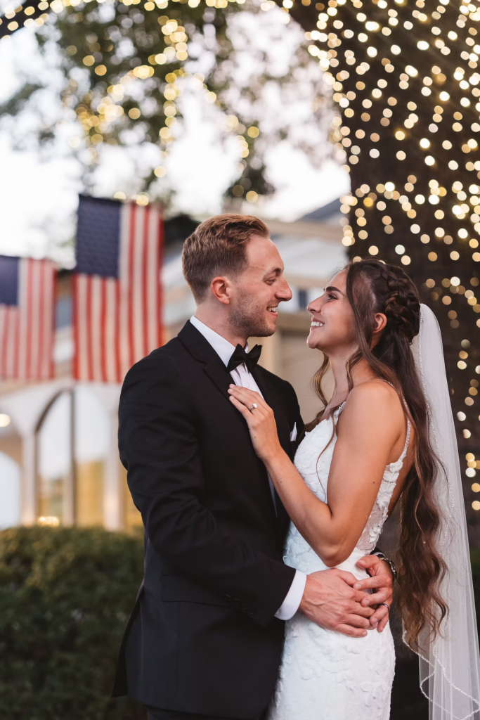 Bride and groom smile for sunset portrait for summer wedding day at The William Penn Inn in Gwynedd, PA. Photographed by Pennsylvania South Jersey area wedding photographer Madison Neumann Photography.
