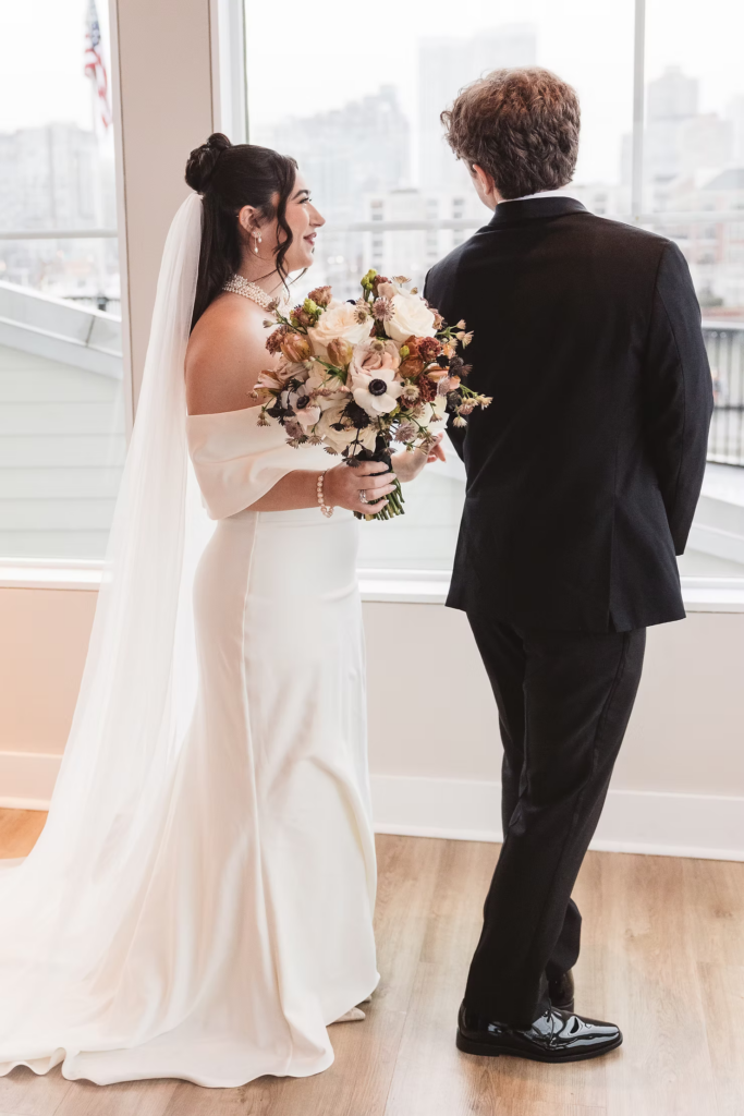 Groom turning around to see bride for their first look before their ceremony. Wedding day at Maritime Parc in Jersey City, NJ. Photographed by South Jersey, Philadelphia based wedding photographer Madison Neumann Photography.