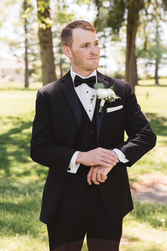 Groom waits outside in suit to see his bride. Wedding day at Downingtown Country Club in Downingtown, PA. Photographed by South Jersey, Philadelphia based wedding photographer Madison Neumann Photography.