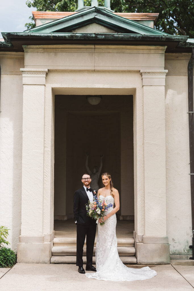 Bride and groom smile together outside their wedding venue. Wedding day at the American Swedish Historical Museum in Philadelphia, PA. Photographed by South Jersey/Philly based wedding photographer Madison Neumann Photography.