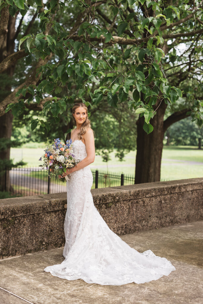 Bridal portrait in her wedding gown, holding bouquet outside venue. Wedding day at the American Swedish Historical Museum in Philadelphia, PA. Photographed by South Jersey/Philly based wedding photographer Madison Neumann Photography.