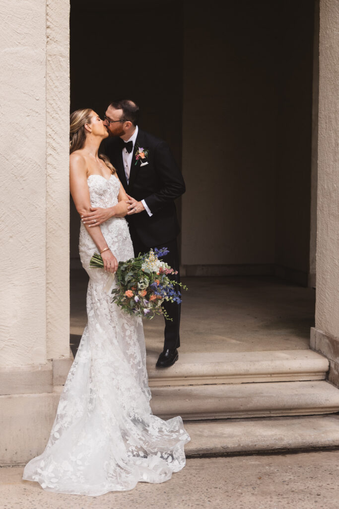 Bride and groom in gown and suit together outside wedding venue. Wedding day at the American Swedish Historical Museum in Philadelphia, PA. Photographed by South Jersey/Philly based wedding photographer Madison Neumann Photography.