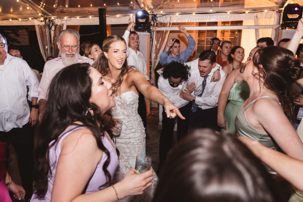Bride on the dance floor with her guests. Wedding day at the American Swedish Historical Museum in Philadelphia, PA. Photographed by South Jersey/Philly based wedding photographer Madison Neumann Photography.
