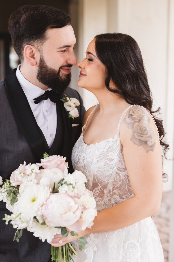 Bride and groom smile together. Wedding day at Blue Heron Pines Golf Club in Egg Harbor, NJ. Photographed by South Jersey/Philly based wedding photographer Madison Neumann Photography.