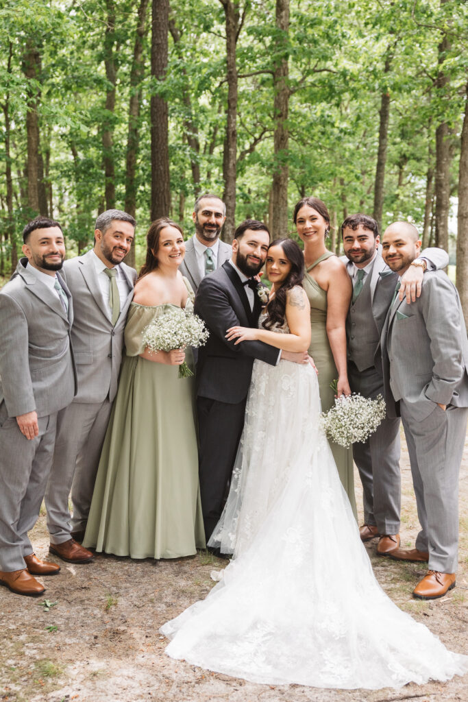 Bride and groom with their wedding party, groomsmen and bridesmaids. Wedding day at Blue Heron Pines Golf Club in Egg Harbor, NJ. Photographed by South Jersey/Philly based wedding photographer Madison Neumann Photography.