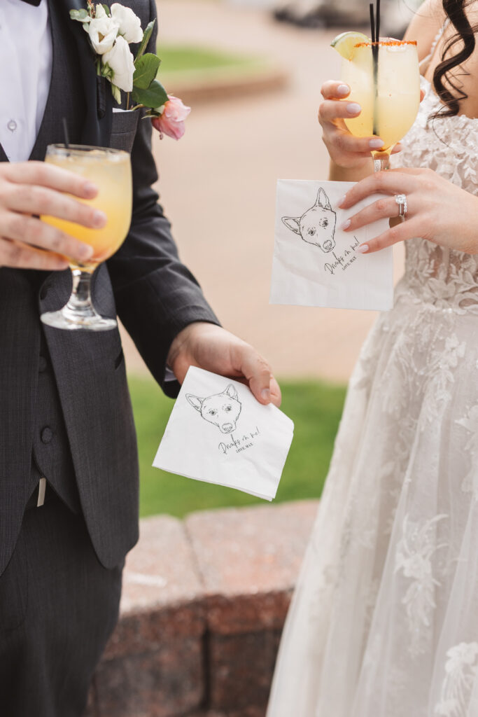 Bride and groom holding cocktails and personalized napkins. Wedding day at Blue Heron Pines Golf Club in Egg Harbor, NJ. Photographed by South Jersey/Philly based wedding photographer Madison Neumann Photography.