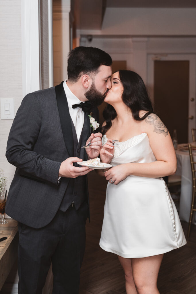 Bride and groom share a slice of wedding cake. Wedding day at Blue Heron Pines Golf Club in Egg Harbor, NJ. Photographed by South Jersey/Philly based wedding photographer Madison Neumann Photography.