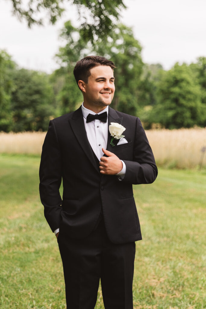 Portrait of groom before first look outside of Woolverton Inn, photographed by New Jersey and Philadelphia based travel wedding photographer Madison Neumann Photography.