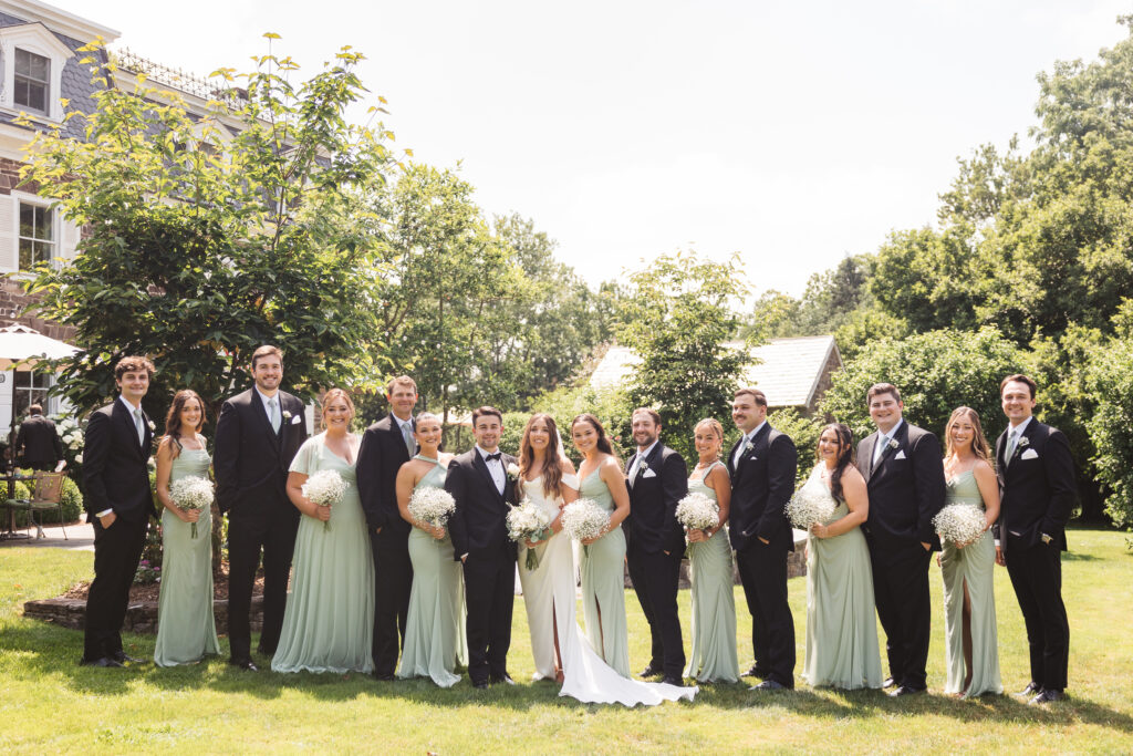 Wide shot of bridal party outside, photographed by New Jersey and Philadelphia based travel wedding photographer Madison Neumann Photography.