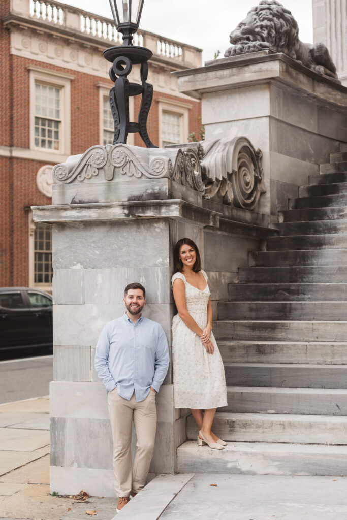 Future Mr. and Mrs. leaning against stone wall and facing the camera, photographed by Philadelphia and New Jersey based travel wedding photographer, Madison Neumann Photography.