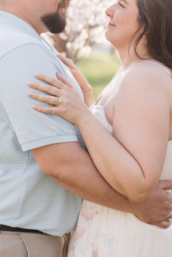 Grooms hands are on brides waist and bride has her ring showing in this detail shot photographed by Philadelphia and New Jersey based travel wedding photographer, Madison Neumann Photography.
