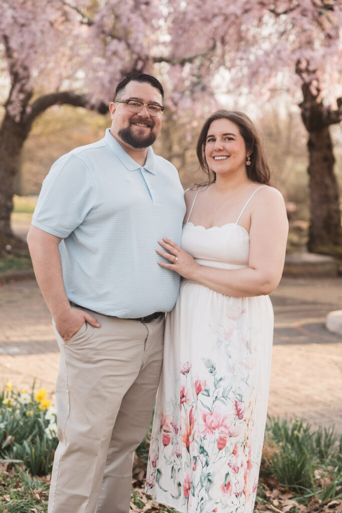 Bride rests her hand on her grooms chest as they stand together and smile at the camera, photographed by Philadelphia and New Jersey based travel wedding photographer, Madison Neumann Photography.