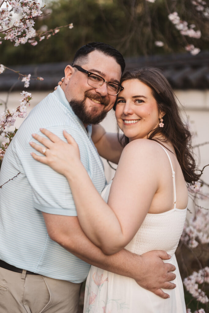 Happy couple holding one another and smiling at the camera, photographed by Philadelphia and New Jersey based travel wedding photographer, Madison Neumann Photography.