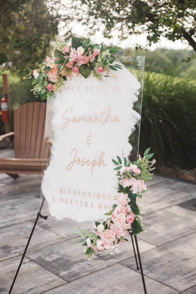 Welcome to our wedding sign with pink roses and leaves, photographed by Philadelphia and New Jersey based travel wedding photographer, Madison Neumann Photography.