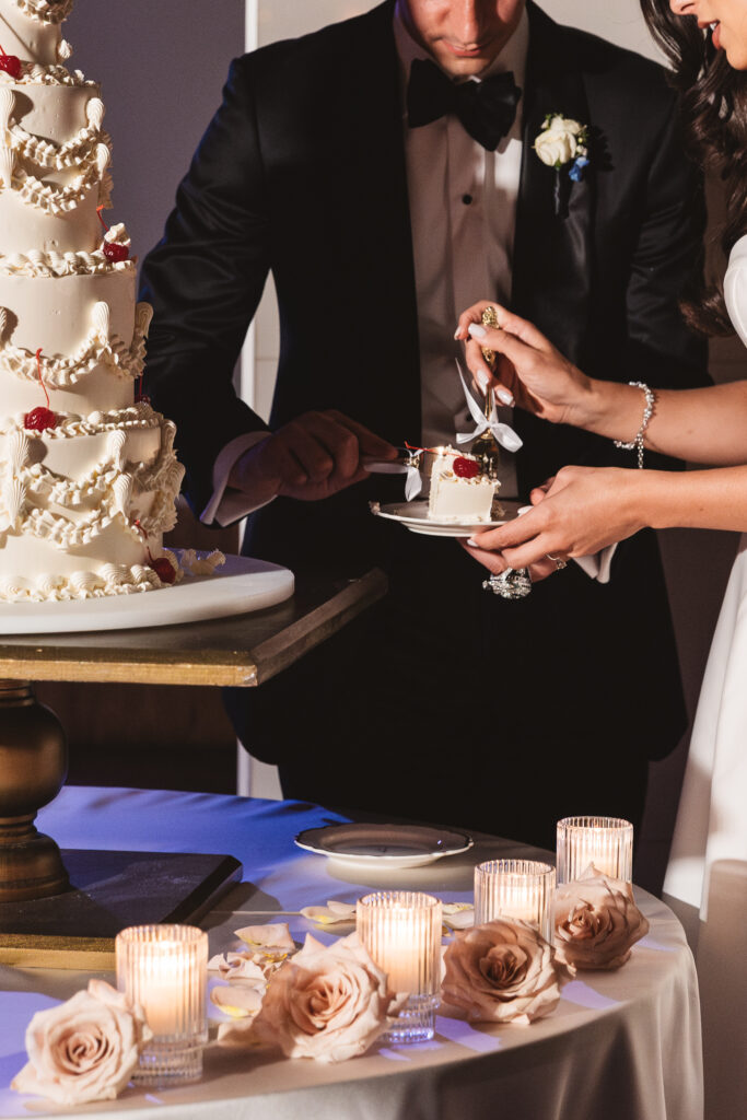 Detail shot of bride cutting the cake with her husband, photographed by Philadelphia and New Jersey based travel wedding photographer, Madison Neumann Photography.