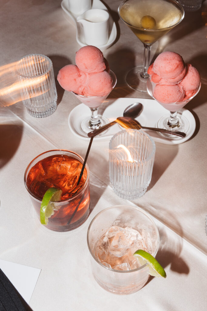 Closing shot of the dessert and signature cocktails on dinner table, photographed by Philadelphia and New Jersey based travel wedding photographer, Madison Neumann Photography.