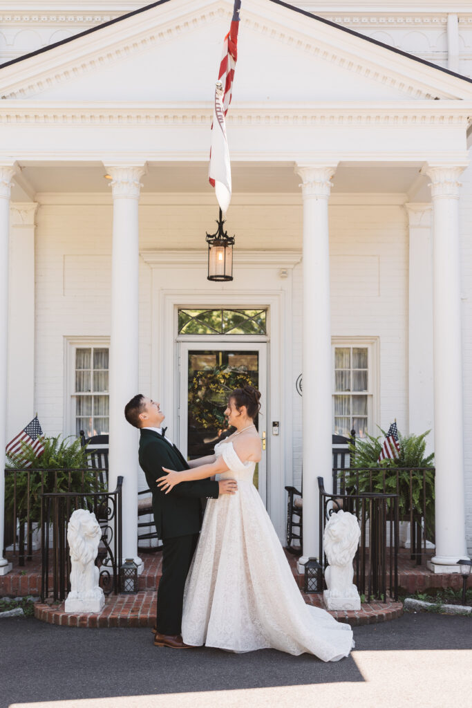 First look between bride and groom in front of the beautiful White Lion Manor in Connecticut, photographed by Philadelphia and New Jersey based travel wedding photographer, Madison Neumann Photography.