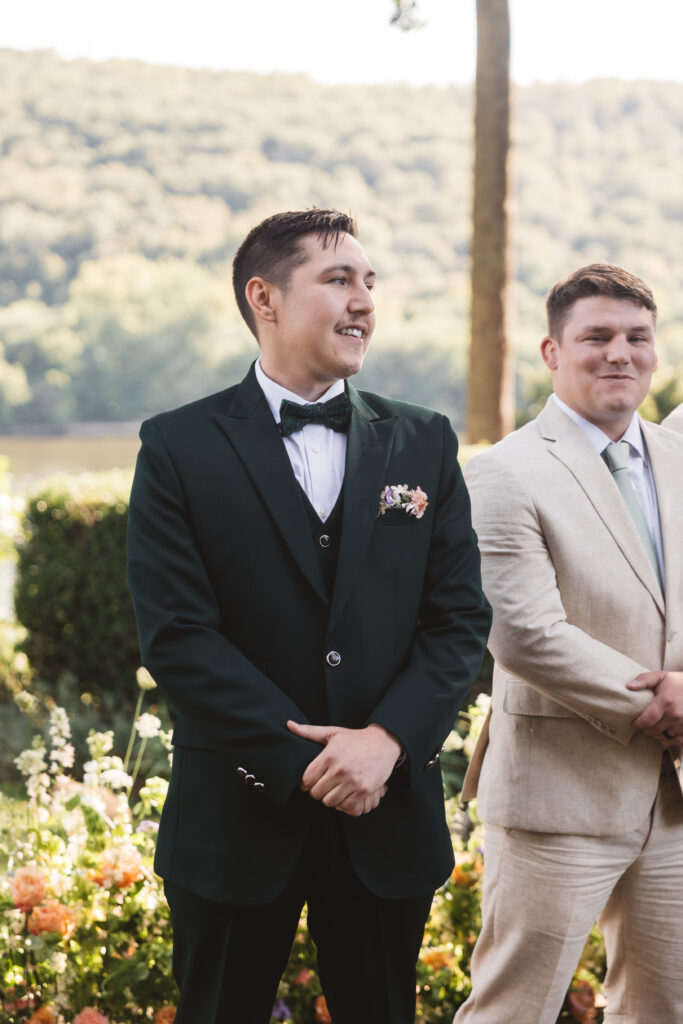 Groom awaiting his beautiful bride at the altar, photographed by Philadelphia and New Jersey based travel wedding photographer, Madison Neumann Photography.