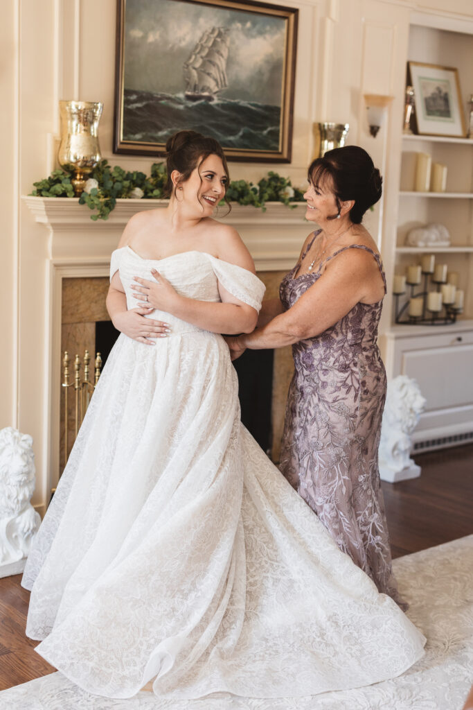 Bride getting ready with her mother at the White Lion Manor, photographed by Philadelphia and New Jersey based travel wedding photographer, Madison Neumann Photography.