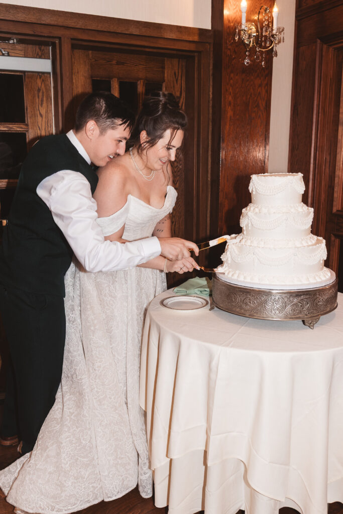 Bride and groom cut their cake together, photographed by Philadelphia and New Jersey based travel wedding photographer, Madison Neumann Photography.