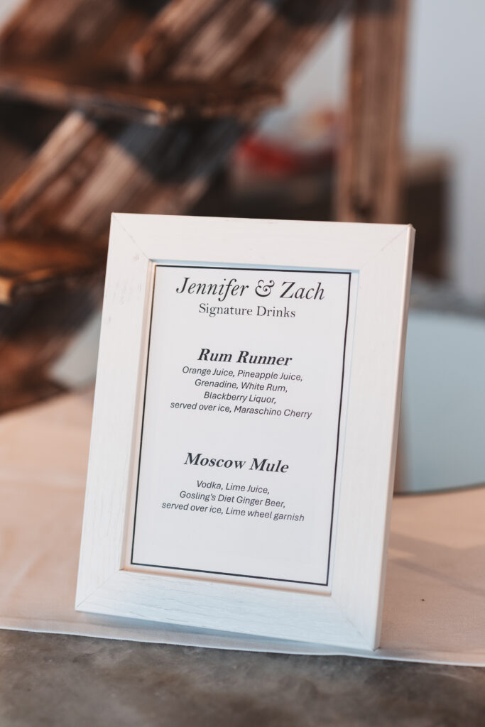 His and Hers signature drinks sign for cocktail hour, photographed by Philadelphia and New Jersey based travel wedding photographer, Madison Neumann Photography.
