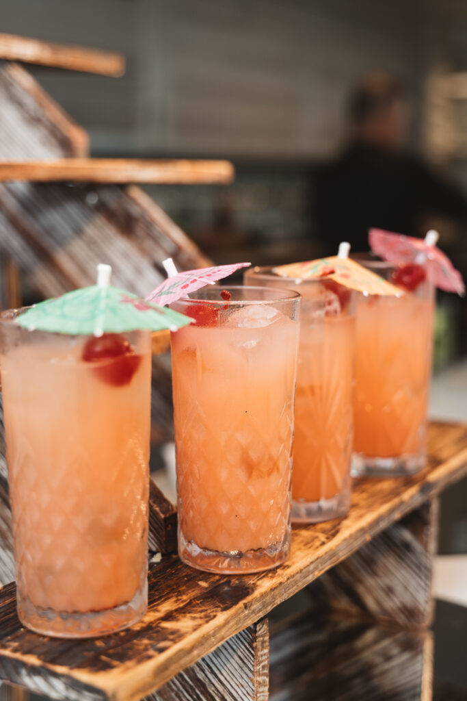 Detail shot of a lineup of the Rum Runners during cocktail hour, photographed by Philadelphia and New Jersey based travel wedding photographer, Madison Neumann Photography.