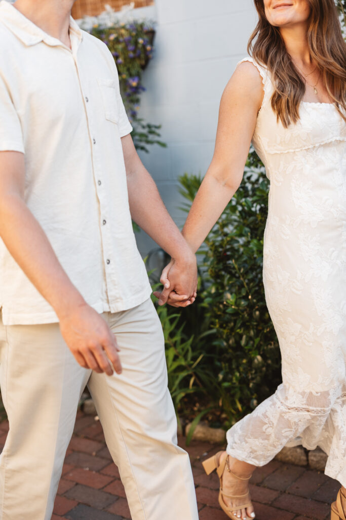 Detail shot of couples outfits as they walk the streets of Cape May hand in hand, photographed by Philadelphia and New Jersey based travel wedding photographer, Madison Neumann Photography.