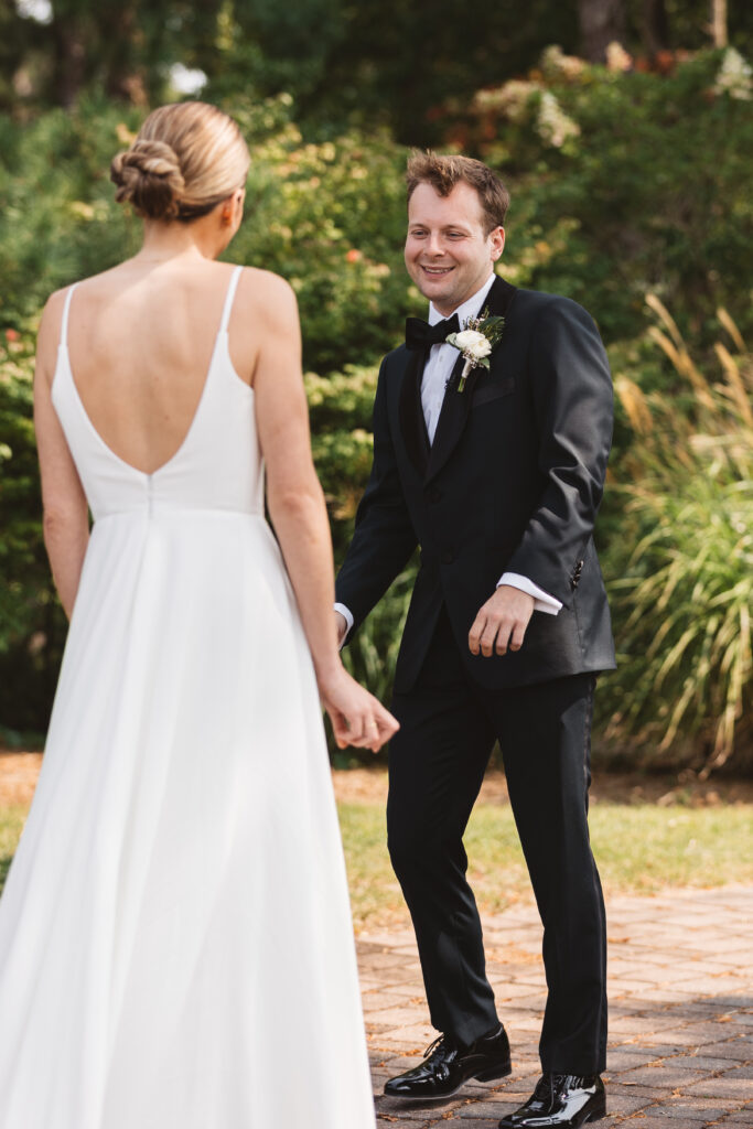First look between bride and groom as we see his reaction to his beautiful bride, photographed by Philadelphia and New Jersey based travel wedding photographer, Madison Neumann Photography.