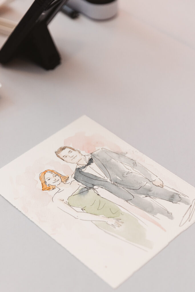 Watercolor painting of a guest by the talented artist who was commissioned for the wedding, photographed by Philadelphia and New Jersey based travel wedding photographer, Madison Neumann Photography.
